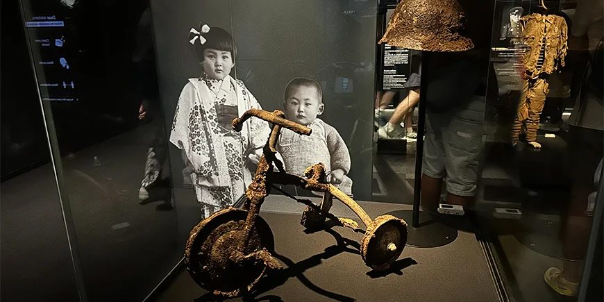 Verbranntes Dreirad aus Hiroshima